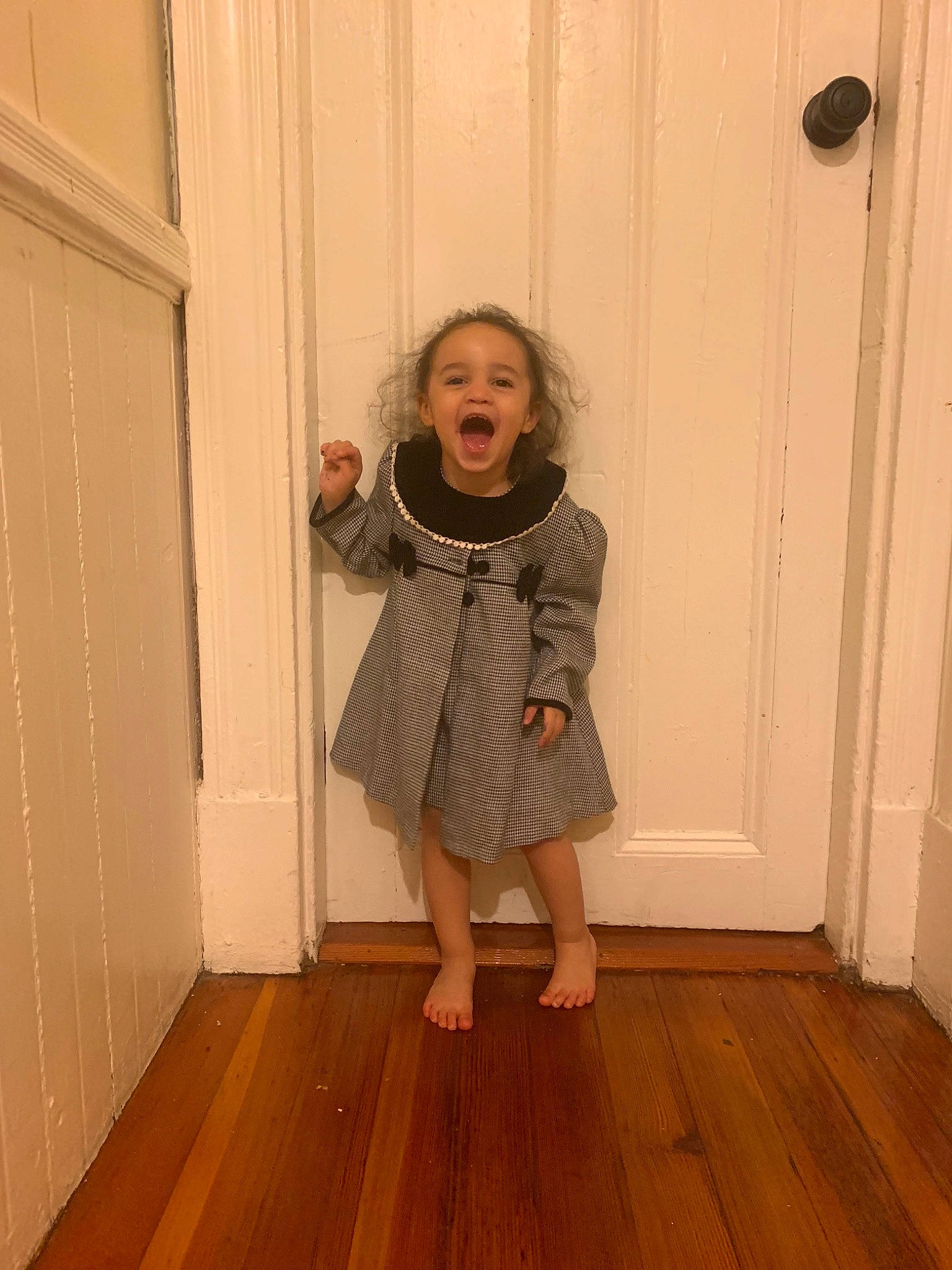 Yuna is registered to the contest to win money with this photo: clothing, fawn, floor, flooring, hardwood, outerwear, person, room, shoulder, standing, wood, wood_flooring