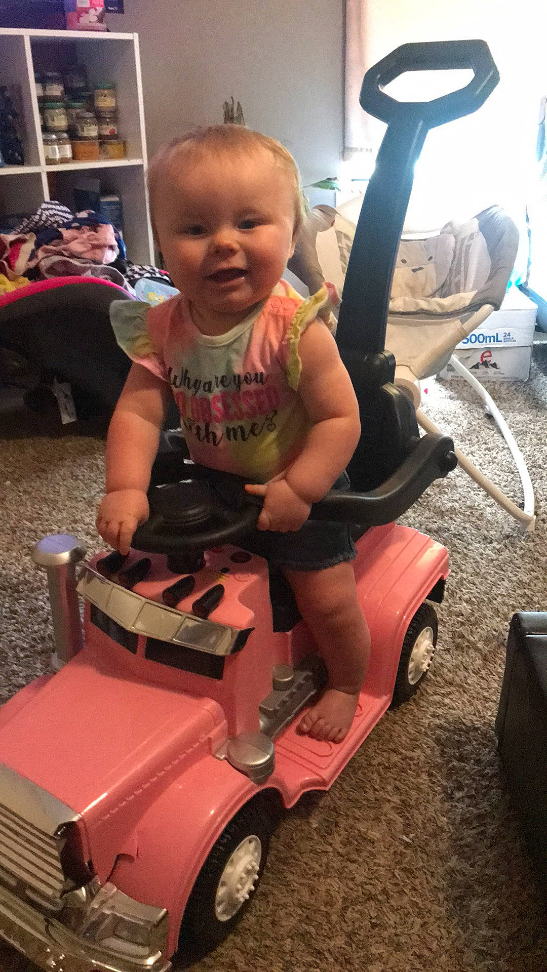 Nevaeh is registered to the contest to win money with this photo: auto_part, automotive_tire, automotive_wheel_system, baby, baby_toddler_clothing, chair, child, fun, human_leg, motor_vehicle, person, product, riding_toy, shelf, shorts, smile, thigh, tire, toddler, vehicle