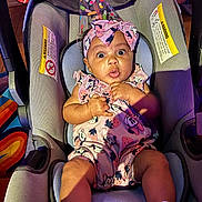 Justice joined the competition — help win amazing prizes! baby, car_seat, party_hat, headband, surprised_expression, infant, clothing, socks, indoor, colorful, child, cute, seat, fabric, person, celebration, portrait, mickey_mouse, pink, fun