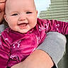 baby, child, infant, smiling, happy, portrait, close_up, person, adult, caregiver, held, magenta_clothing, fleece, patterned_outfit, window, outdoor, home, daylight, face, photography