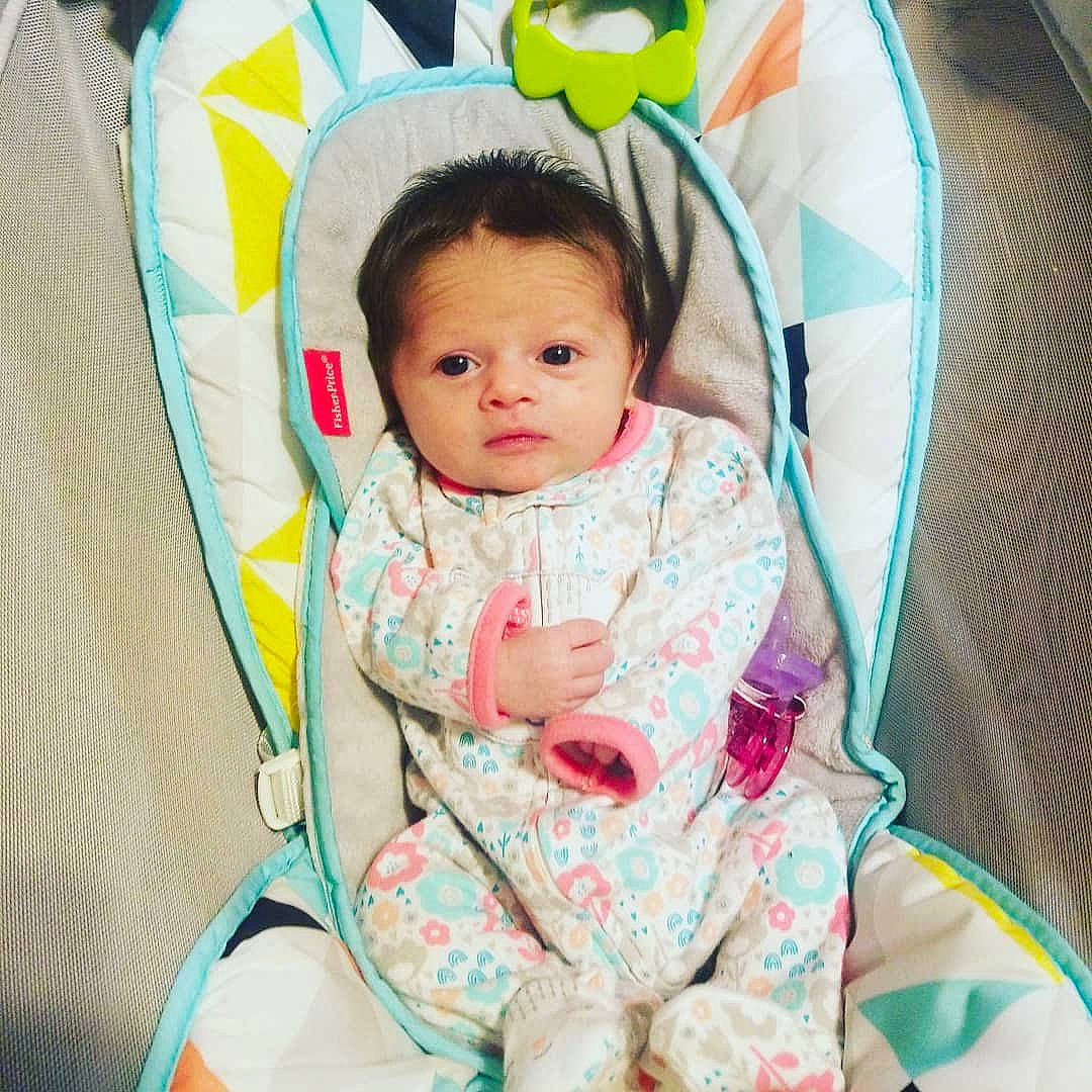 Emmalynn is registered to the contest to win money with this photo: baby, baby_in_car_seat, baby_products, child, head, person, pink, product, skin, smile, toddler