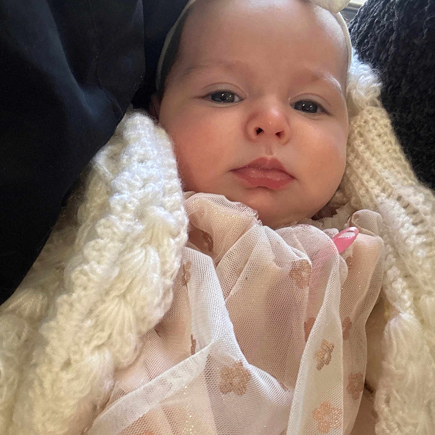 Clementine is registered to the contest to win money with this photo: baby, blanket, bonnet, clothing, coat, cushion, face, hat, head, homedecor, hood, jacket, linen, newborn, person, photography, portrait, quilt, sleeping, towel