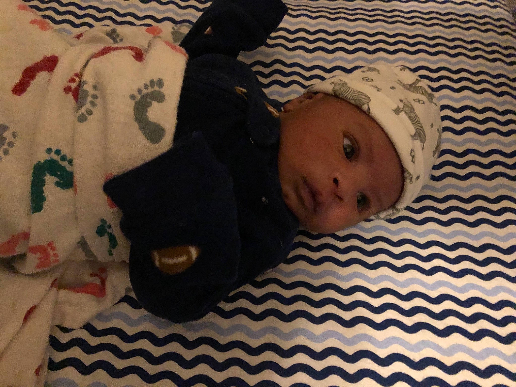 Erik is registered to the contest to win money with this photo: baby, baby_products, baby_safety, baby_sleeping, baby_toddler_clothing, bed, bed_sheet, bedding, bedtime, child, comfort, flooring, headwear, linens, pattern, person, room, skin, sleeve, textile