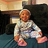baby, child, infant, smiling, happy, portrait, sitting, bed, cushion, pajamas, headband, indoor, bedroom, mirror, red_lights, home, barefoot, tongue_out, furniture, photography