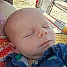 baby, sleeping, infant, closeup, face, child, outdoor, beach, chair, sunlight, person, peaceful, relaxing, clothing, portrait, head, skin, hand, fabric, summer