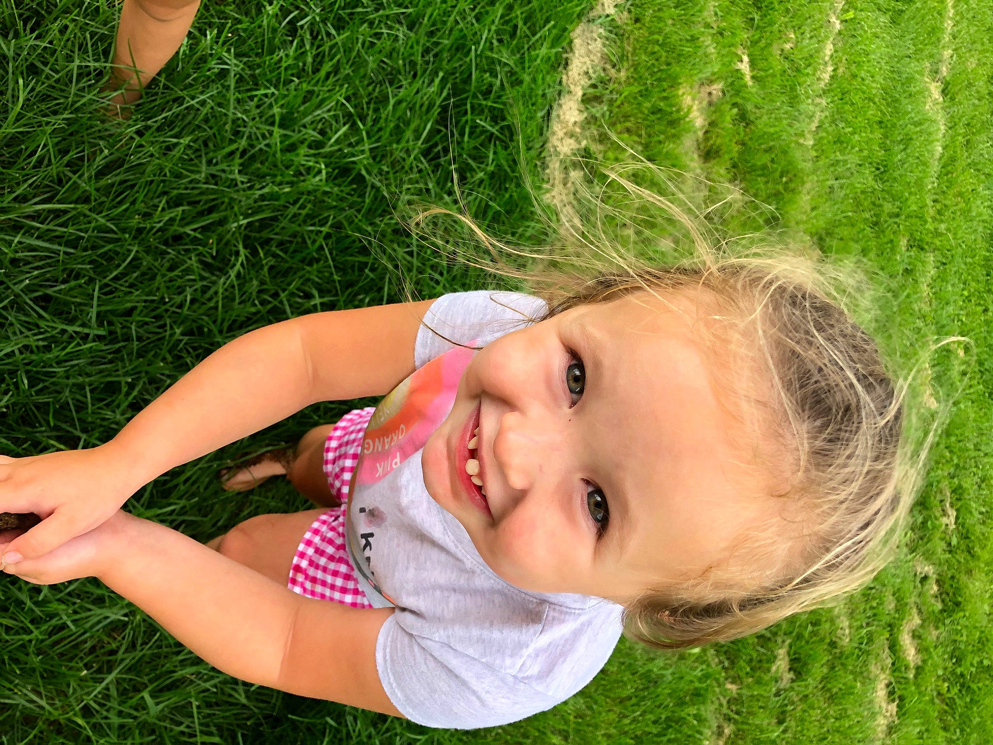 Eleanor is registered to the contest to win money with this photo: baby, child, ear, grass, grass_family, green, happy, joy, lawn, meadow, people_in_nature, person, photography, plant, skin, smile, summer, toddler