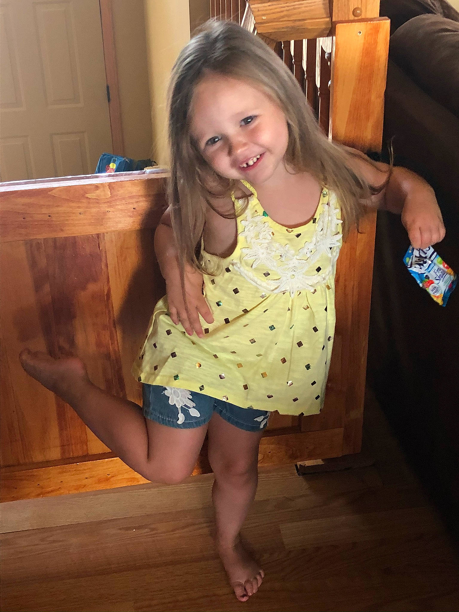 Eleanor is registered to the contest to win money with this photo: abdomen, brown_hair, child, design, finger, floor, fun, human_leg, joy, leg, long_hair, neck, pattern, person, polka_dot, room, shoulder, sitting, smile, thigh