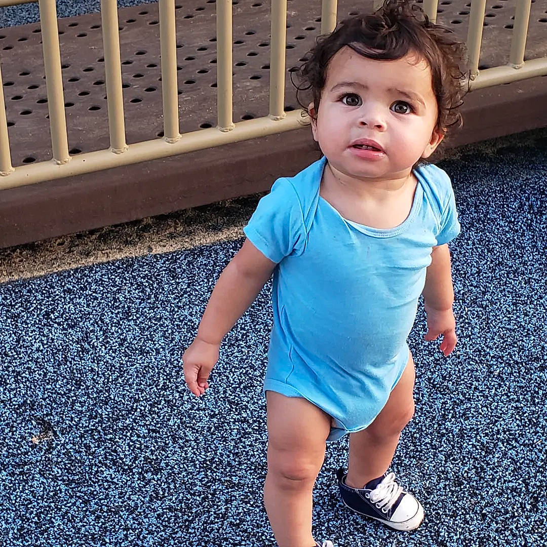 Aaron Judah is registered to the contest to win money with this photo: arm, azure, baby_toddler_clothing, blue, cool, eye, face, finger, hair, happy, head, joint, light, line, person, shoulder, sleeve, standing, t_shirt, toddler