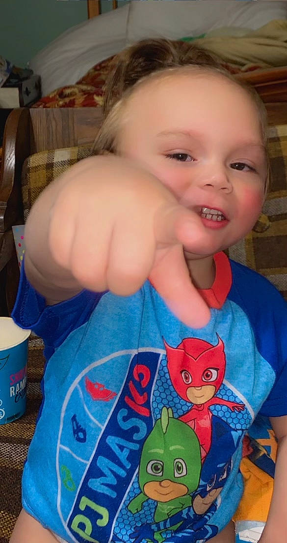 Kyree is registered to the contest to win money with this photo: arm, baby_toddler_clothing, cheek, eye, finger, gesture, hand, happy, head, human_body, iris, joint, mammal, mouth, neck, nose, person, skin, sleeve, smile