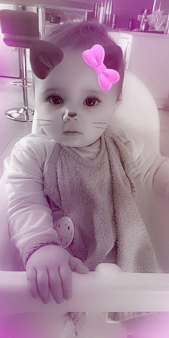 Nélia participe au concours pour gagner de l'argent avec cette photo : cheek, child, doll, ear, eye, face, girl, infant, lip, organ, person, pink, product, purple, skin, textile, toddler