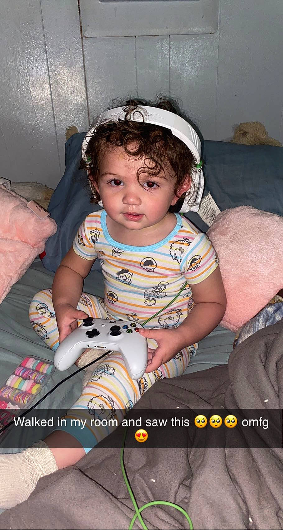 Ariya is registered to the contest to win money with this photo: audio_equipment, baby, baby_carriage, baby_products, baby_toddler_clothing, child, comfort, couch, fashion_accessory, flash_photography, fun, gadget, hairstyle, happy, human_leg, lap, person, sitting, sunglasses, thigh