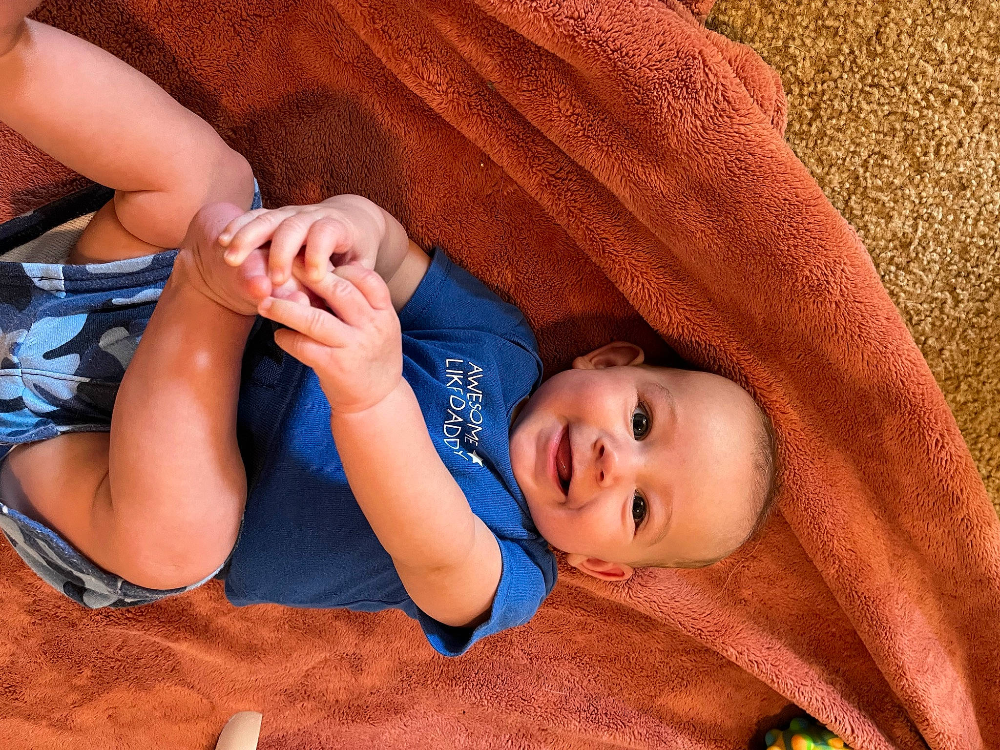 Bennett joined the competition — help win amazing prizes! baby, baby_toddler_clothing, child, comfort, finger, fun, gesture, grass, happy, headgear, joy, mouth, nail, nose, orange, person, skin, smile, thigh, thumb