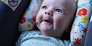 Willow joined the competition — help win amazing prizes! baby, blue_eyes, child, close_up, clothing, comfort, cushion, cute, expression, face, floral_pattern, happy, head, indoor, infant, newborn, portrait, skin, smile, soft_lighting