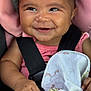 Azalea is registered to the contest to win money with this photo: baby, smiling, closeup, car_seat, pink, blanket, infant, child, happy, face, cute, person, seatbelt, clothing, hand, portrait, young, indoors, comfort, toddler