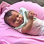 baby, infant, pink_blanket, clothing, face, hands, expression, lying_down, soft_texture, indoor, cute, child, person, closeup, head, skin, newborn, comfortable, cozy, portrait
