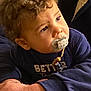 Eden a rejoint le concours — aidez-le/la à gagner de superbes lots ! adult_hand, arm, blue_shirt, child, close_up, curious, curly_hair, cute, expression, face, family, indoor, looking_up, pacifier, pacifier_clip, portrait, sleeve, soft_lighting, toddler, young_child