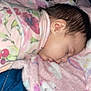 Kehlani joined the competition — help win amazing prizes! baby, sleeping, blanket, floral_pattern, pink, fleece, face, head, rest, cozy, child, infant, soft_texture, peaceful, portrait, indoor, comfort, warm, person, cute