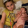 Kehlani is registered to the contest to win money with this photo: child, baby, feeding, bottle, tiara, angel_wings, pajamas, rainbow_lanyard, necklace, pink_onesie, sitting, indoor, bedroom, family, love, cute, portrait, happy, girl, infant
