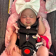 Shiloh joined the competition — help win amazing prizes! baby, infant, sleeping, car_seat, headband, bow, pink, fluffy, straps, safety_harness, cute, child, apparel, resting, indoors, skin, hand, footwear, fabric, portrait