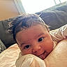 Shiloh joined the competition — help win amazing prizes! baby, infant, face, tongue, hair, eyes, smile, couch, pillow, indoors, resting, closeup, cute, child, person, soft, cozy, clothing, skin, happy