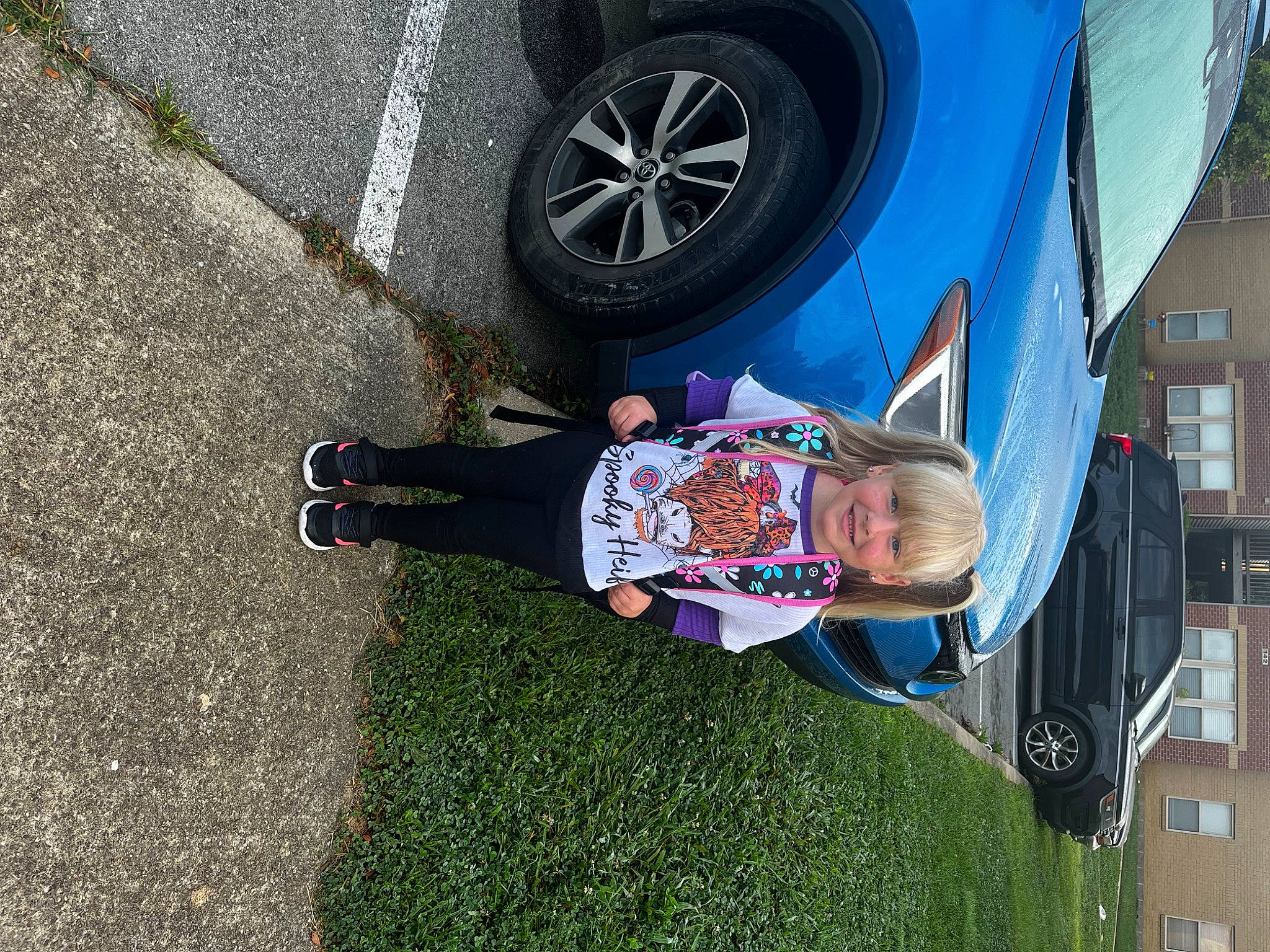 Hadleigh is registered to the contest to win money with this photo: alloy_wheel, asphalt, automotive_exterior, automotive_lighting, automotive_tire, car, electric_blue, fender, hubcap, joy, motor_vehicle, person, plant, rim, smile, tire, tire_care, toddler, vehicle, vehicle_door