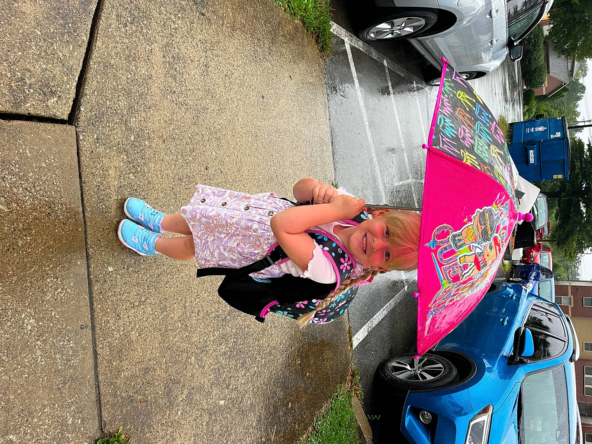 Hadleigh joined the competition — help win amazing prizes! art, automotive_design, automotive_exterior, bumper, car, grass, human_leg, joy, leisure, motor_vehicle, person, pink, recreation, shoe, shorts, sidewalk, tire, toddler, tree, vehicle