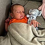 baby, blanket, child, comfort, couch, cozy, cute, face, furniture, hand, indoor, infant, orange_clothing, peaceful, pillow, plush_elephant, relaxation, rest, sleeping, soft_texture