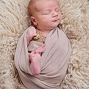Frankie is registered to the contest to win money with this photo: newborn, baby, infant, swaddled, blanket, soft, fluffy, rug, sleeping, peaceful, cute, tiny_feet, wrapped, portrait, closeup, indoors, cozy, skin, head, resting