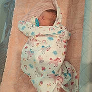 Sophia is registered to the contest to win money with this photo: newborn, baby, blanket, swaddled, crib, mattress, mesh, sleeping, pacifier, soft, unicorn, pattern, infant, cozy, resting, cute, bed, child, peaceful, nursery