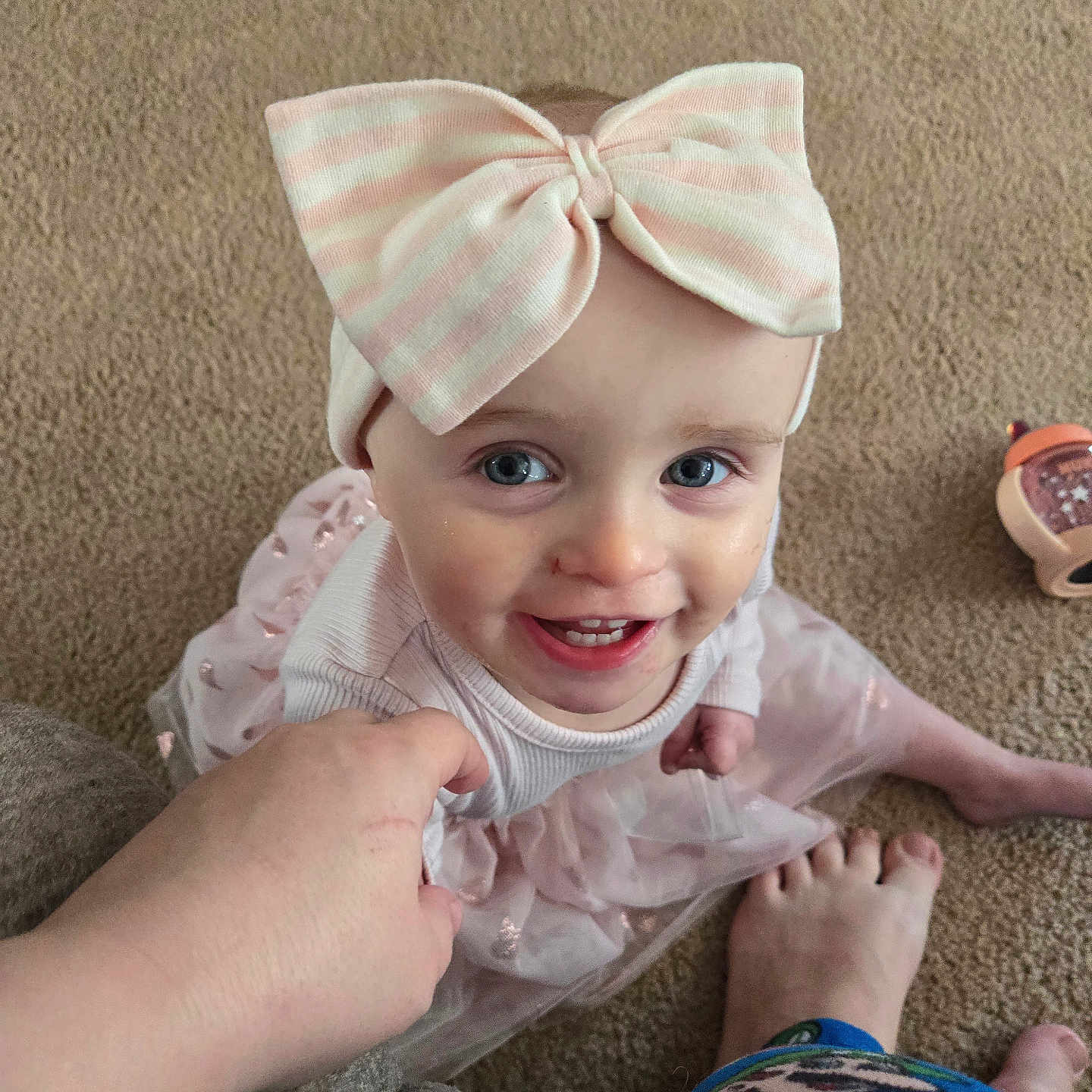 Briliee is registered to the contest to win money with this photo: accessories, baby, clothing, couch, cushion, dress, face, formalwear, furniture, happy, hat, head, homedecor, laughing, pants, person, photography, portrait, smile, tie