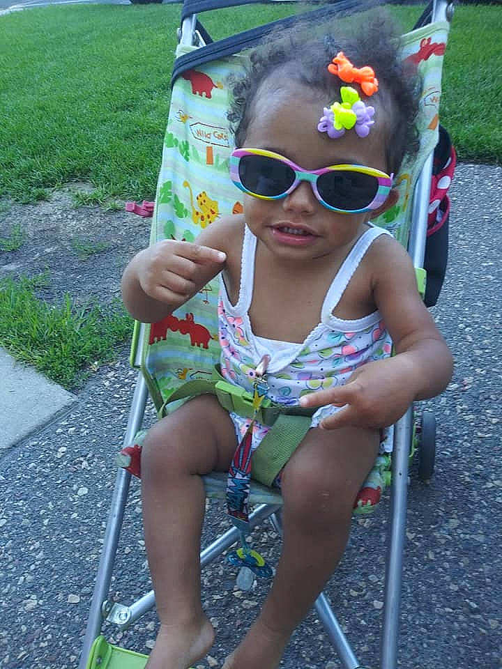 Tanaya joined the competition — help win amazing prizes! baby_toddler_clothing, chair, eyewear, face, flower, fun, goggles, grass, green, happy, head, leaf, leisure, person, photograph, pink, plant, public_space, recreation, summer
