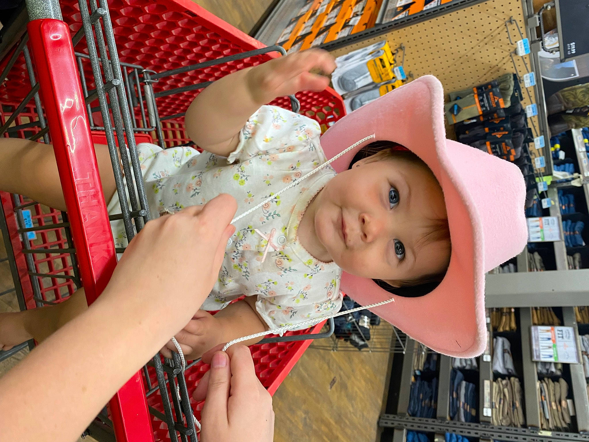 Sutton is registered to the contest to win money with this photo: baby, baby_products, baby_toddler_clothing, building, child, fashion_accessory, fun, happy, hat, headwear, human_leg, leisure, pattern, person, retail, shelf, shopping, skin, smile, thigh