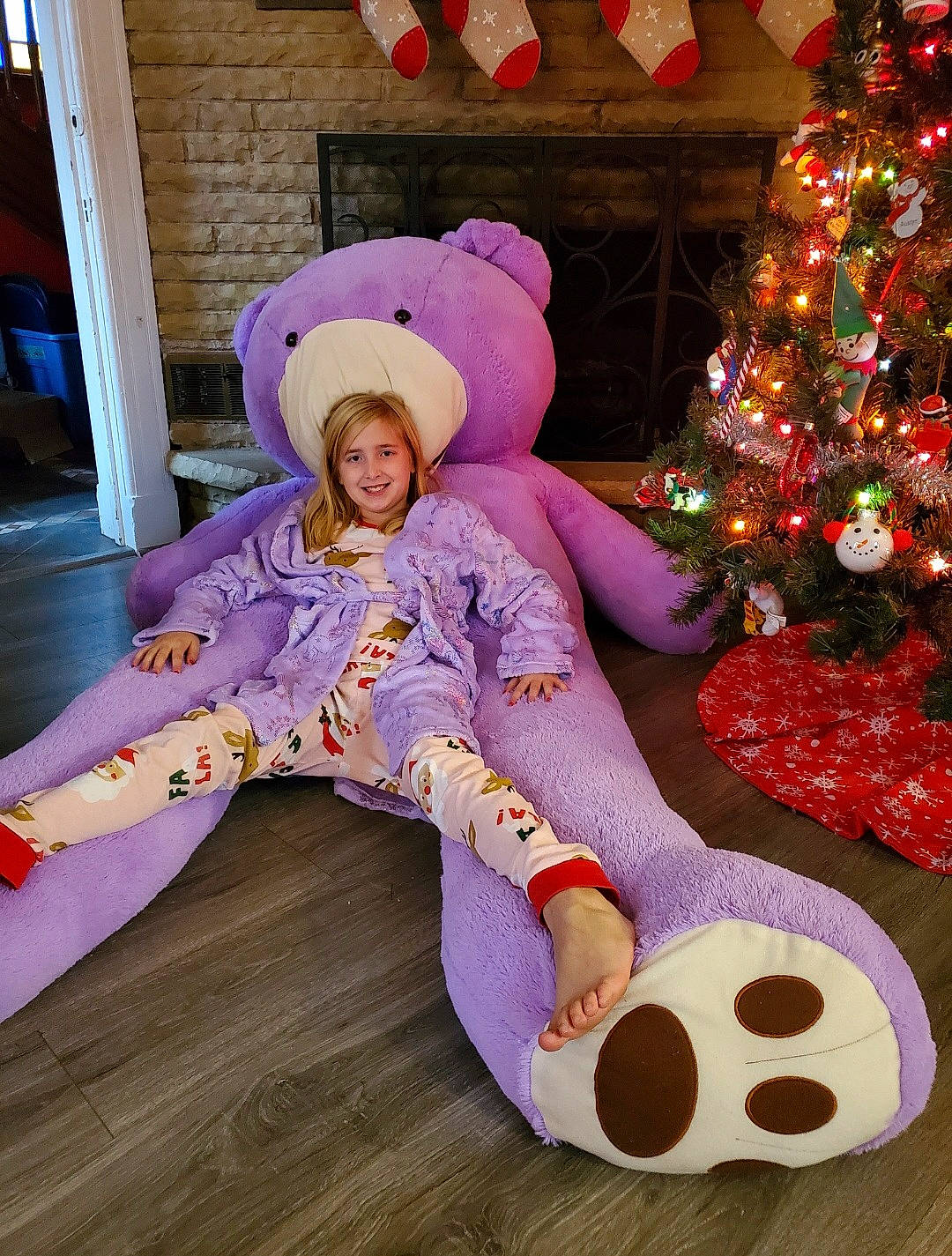 Chloe joined the competition — help win amazing prizes! baby_toddler_clothing, christmas_decoration, christmas_ornament, christmas_tree, comfort, costume_hat, event, fun, fur, happy, hat, holiday, holiday_ornament, joy, lap, magenta, ornament, person, pink, purple