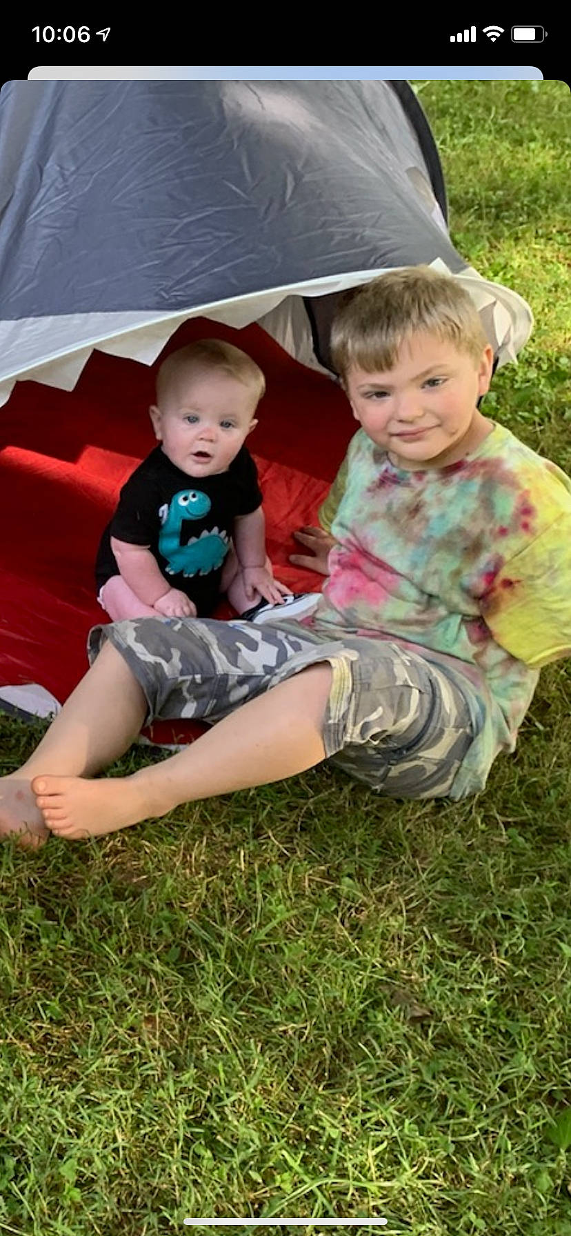 Darius joined the competition — help win amazing prizes! face, fun, grass, happy, joy, lap, leaf, leg, leisure, people_in_nature, person, photograph, plant, recreation, sharing, shorts, smile, sneakers, t_shirt, tent