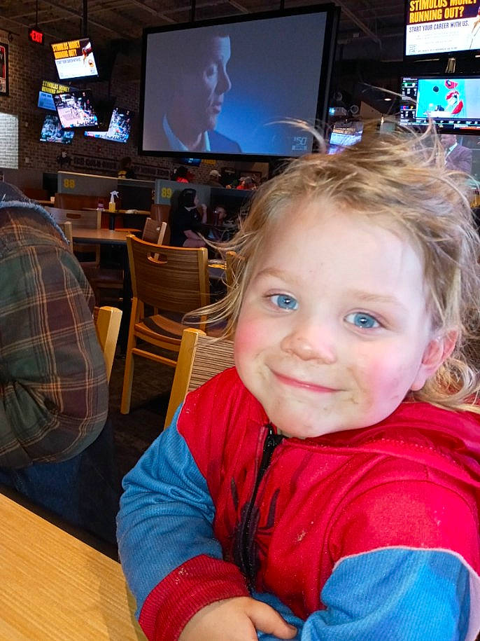 Dwayne is registered to the contest to win money with this photo: blue, cable_television, chair, event, flat_panel_display, flooring, fun, furniture, gadget, happy, hardwood, joy, leisure, person, recreation, smile, table, tartan, television, television_set