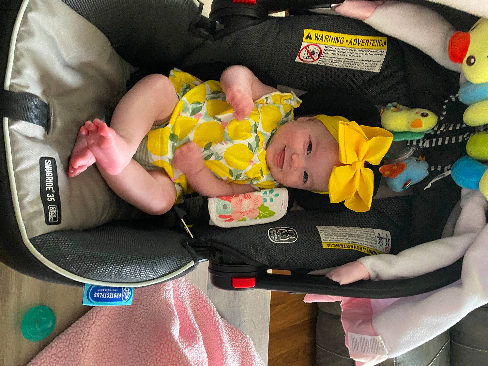 Jayda joined the competition — help win amazing prizes! baby, baby_carriage, baby_products, baby_safety, baby_toddler_clothing, car_seat, child, comfort, finger, fun, green, headwear, joy, lap, person, product, sitting, toddler, yellow