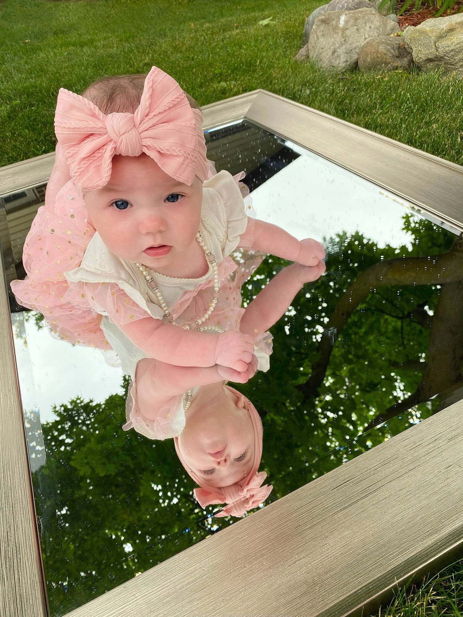 Jayda joined the competition — help win amazing prizes! baby_products, baby_toddler_clothing, child, fun, garden, grass, green, happy, headwear, leaf, leisure, people_in_nature, person, pink, plant, play, sitting, summer, swing, toddler