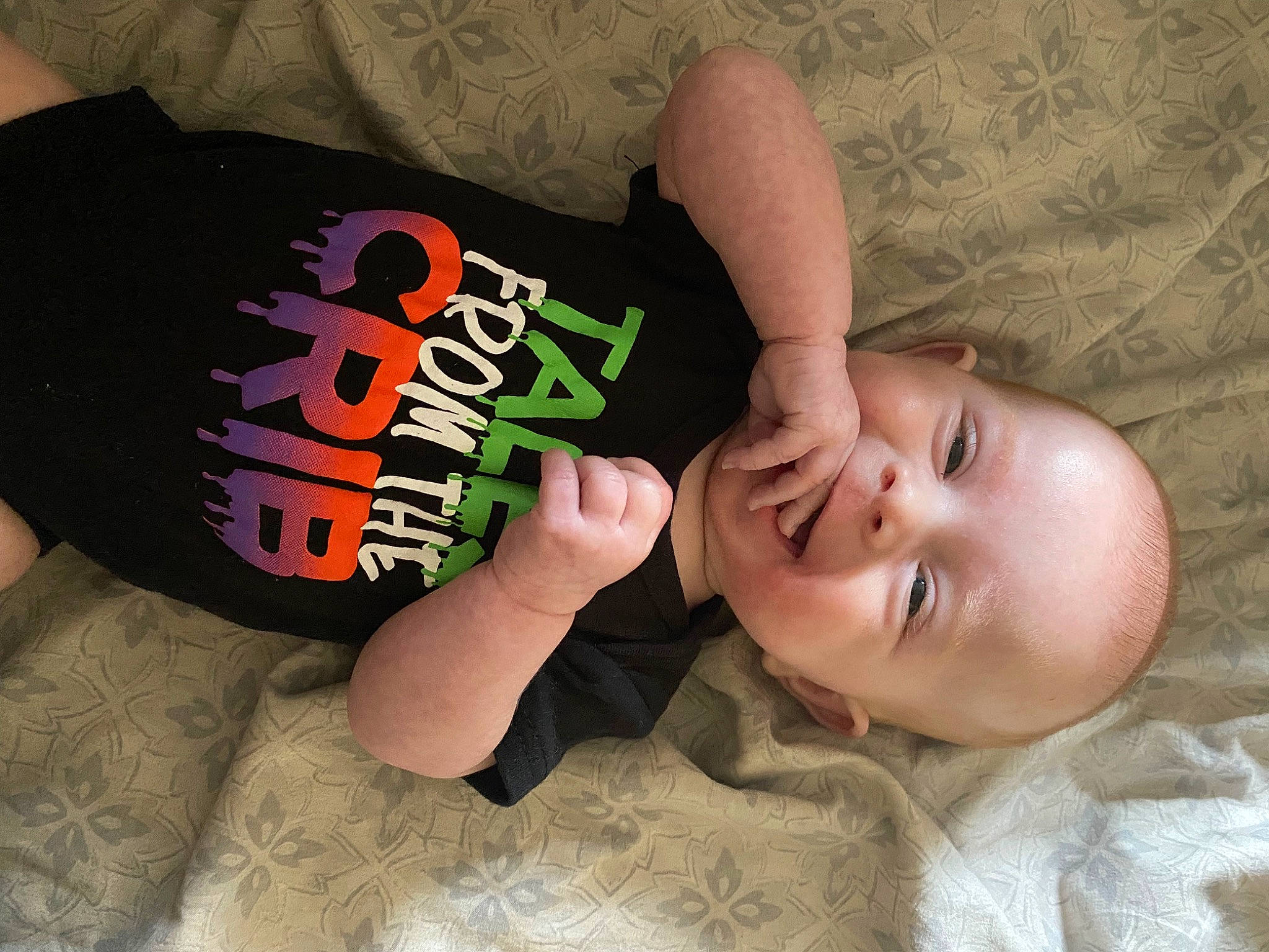 Kelly is registered to the contest to win money with this photo: arm, baby, baby_toddler_clothing, cheek, child, comfort, elbow, eyelash, finger, human_body, nail, neck, pattern, person, skin, sleeve, thigh, thumb, toddler, wood