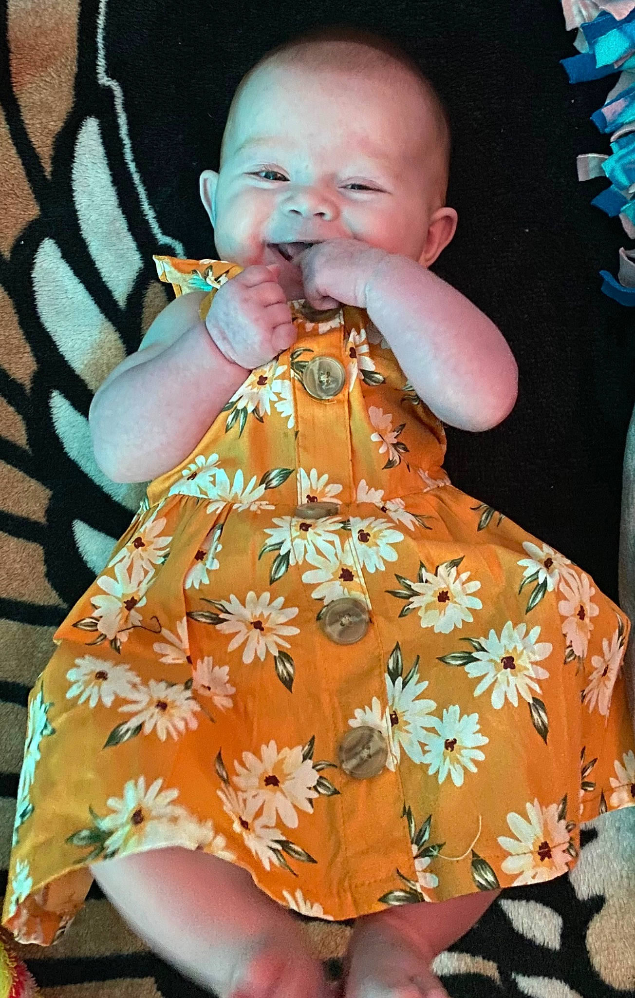 Kelly joined the competition — help win amazing prizes! arm, baby, baby_toddler_clothing, child, dress, eye, face, green, hairstyle, hand, happy, head, human_body, iris, orange, pattern, person, pink, product, sleeve