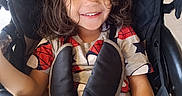 Art Iv is registered to the contest to win money with this photo: baby, bright, casual, child, childhood, clothing, curly_hair, cute, face, happy, indoor, joy, kid, person, portrait, seated, smile, spiderman_shirt, stroller, young