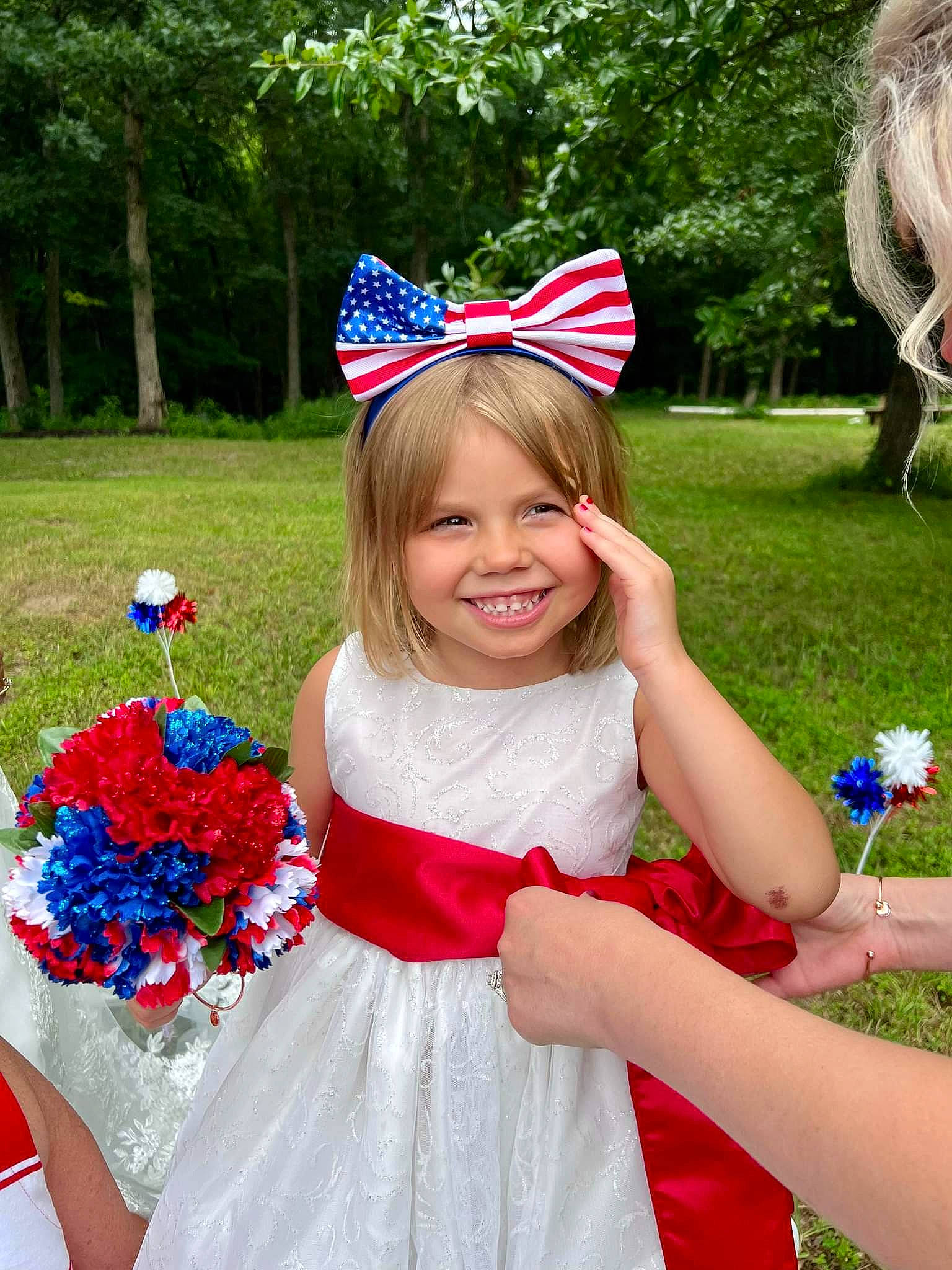 Adisen is registered to the contest to win money with this photo: blue, costume_hat, dress, facial_expression, flower, fun, grass, happy, joy, party_hat, person, petal, pink, plant, recreation, red, smile, summer, textile, toddler