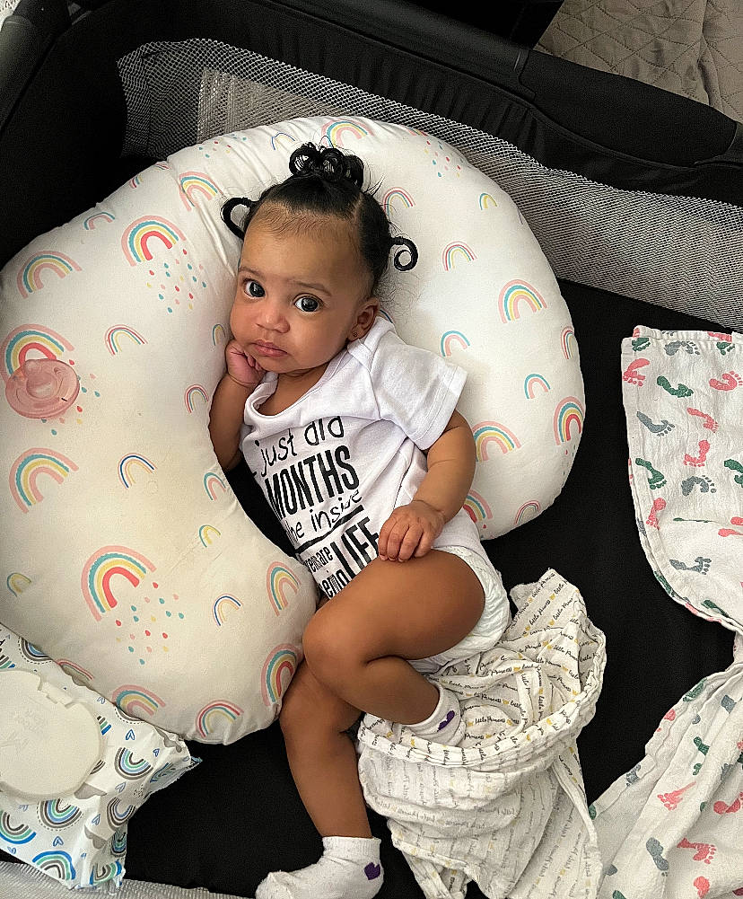Samira joined the competition — help win amazing prizes! baby, baby_toddler_clothing, car_seat, child, comfort, hairstyle, happy, head, human_leg, leg, mammal, pattern, person, product, shorts, sleeve, t_shirt, textile, thigh, toddler