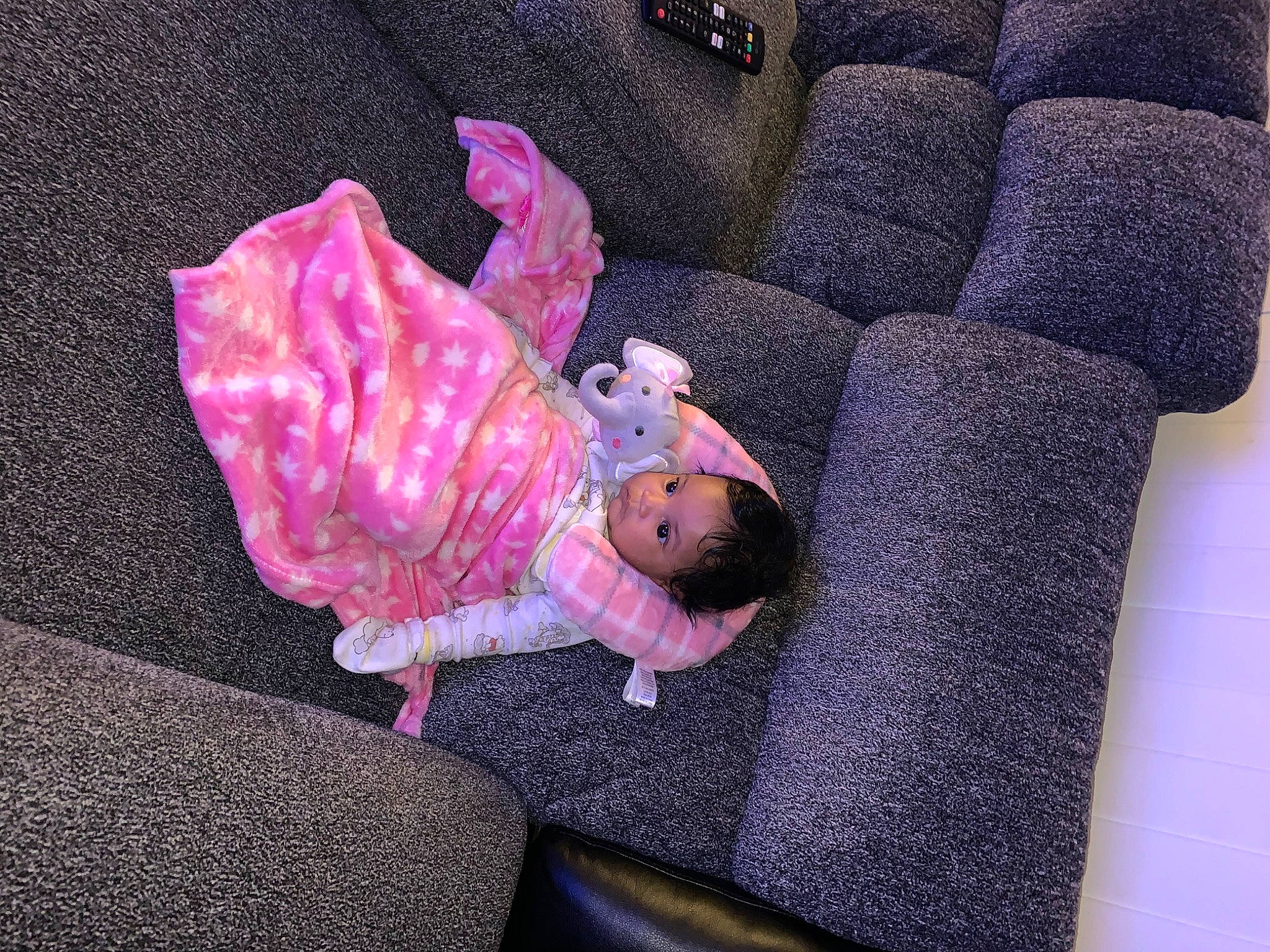 Samira joined the competition — help win amazing prizes! baby_toddler_clothing, comfort, couch, flooring, fur, linens, magenta, person, purple, room, sitting, stuffed_toy, textile, toy, wood