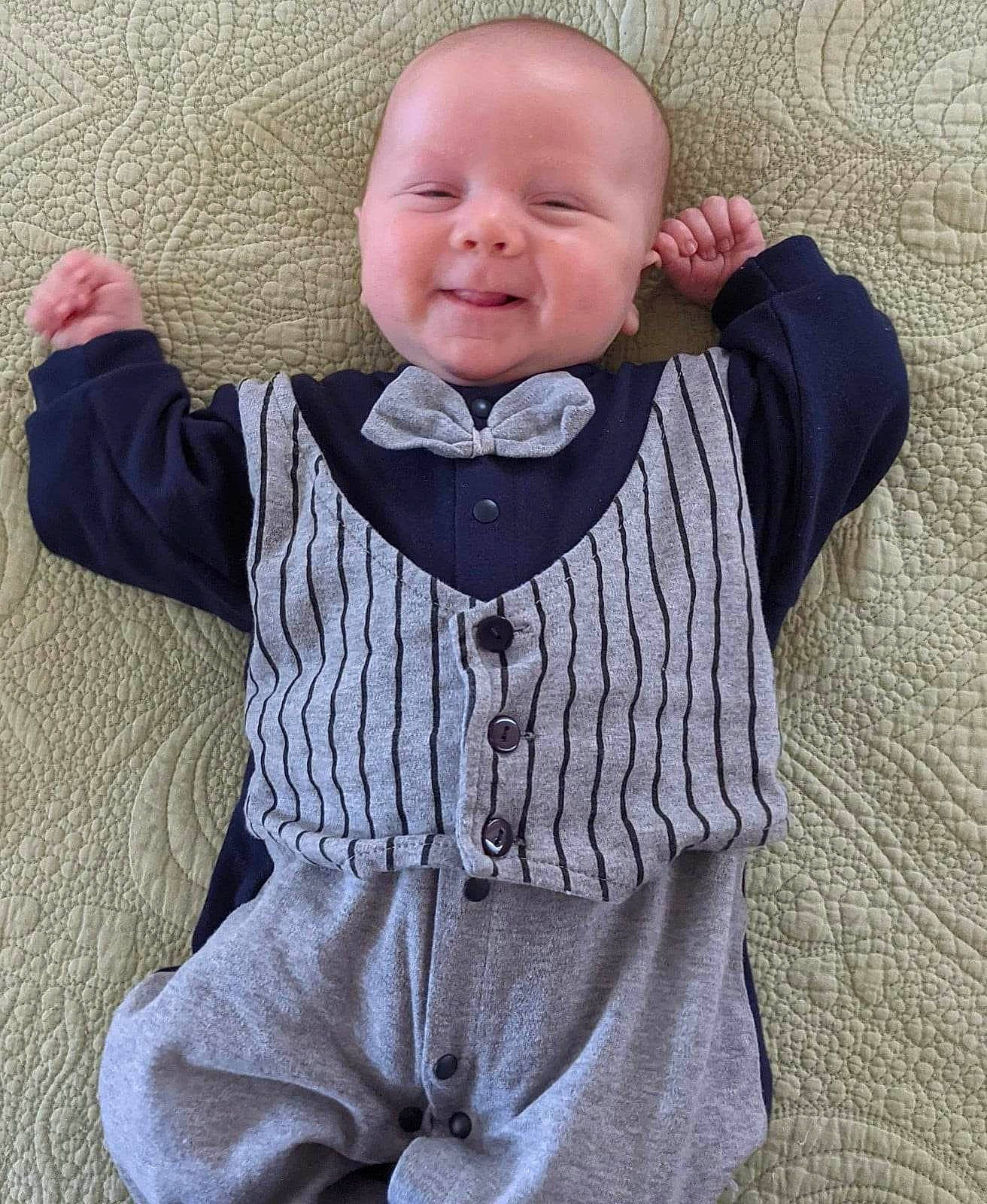 Felix joined the competition — help win amazing prizes! baby, baby_products, baby_toddler_clothing, button, child, collar, dress_shirt, grey, joy, long_sleeved_t_shirt, neck, outerwear, pattern, person, pink, sleeve, smile, t_shirt, toddler, wood