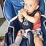 bib, blue_high_chair, child, curtain, dog, eating, expression, face, floor, furniture, hair, home, indoor, person, seatbelt, shorts, sock, toddler, watermelon, window