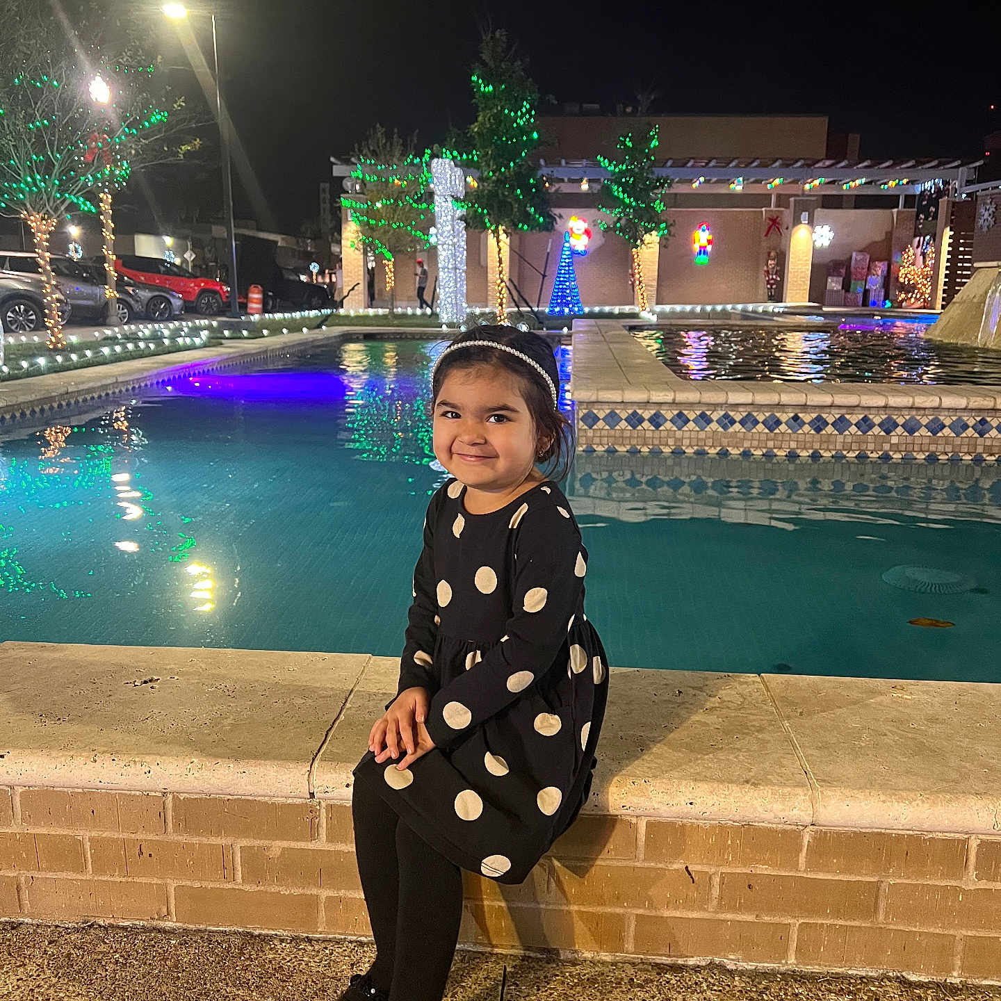 Victoria is registered to the contest to win money with this photo: child, clothing, coat, dress, face, female, formalwear, girl, happy, head, lighting, path, pattern, person, photography, portrait, smile, standing, walkway, water