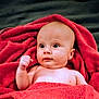baby, infant, towel, red, skin, bare_chest, blanket, expression, face, head, eyes, hand, fist, lying_down, indoor, portrait, cute, child, newborn, soft_texture