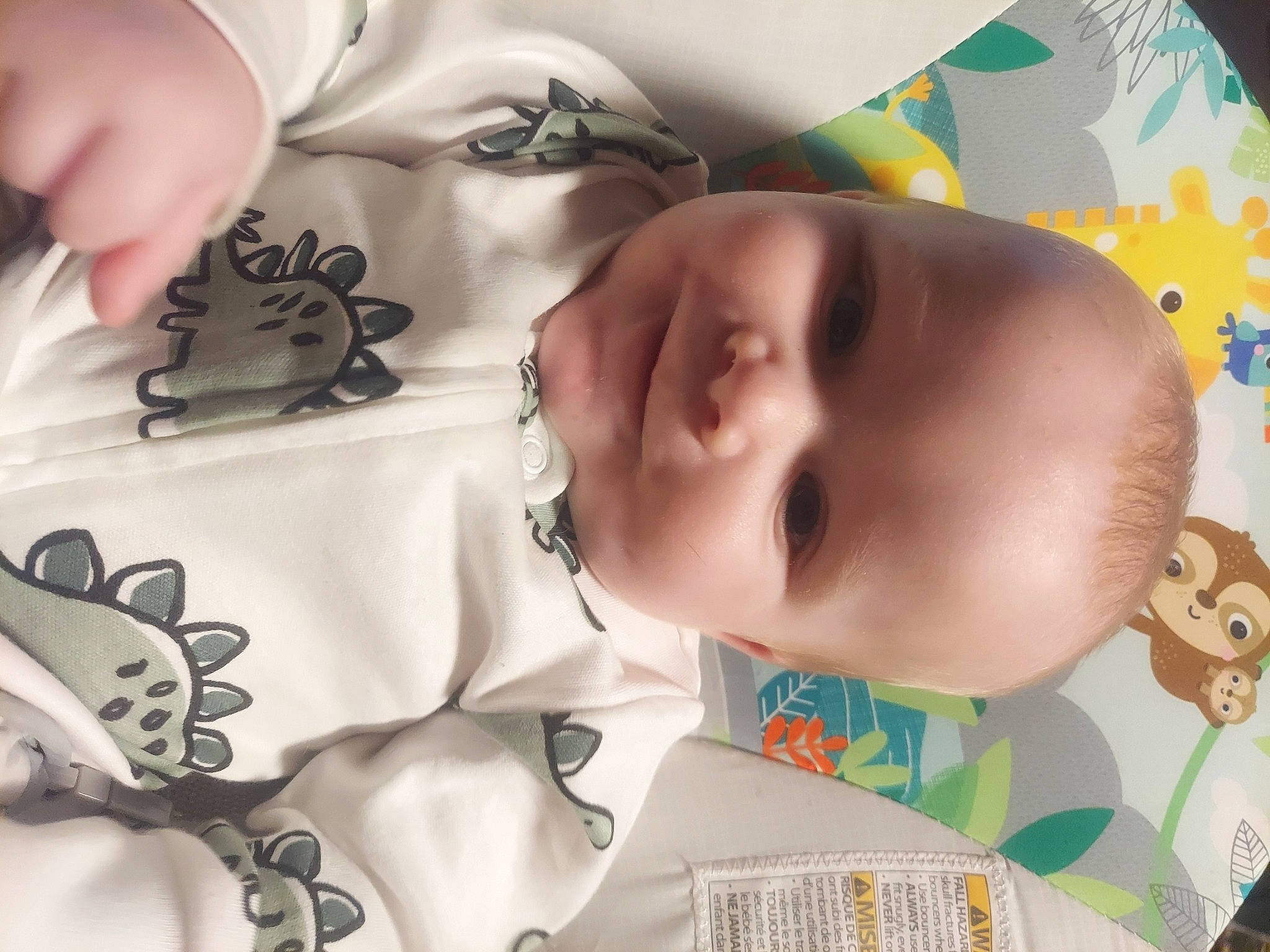 Kaiden is registered to the contest to win money with this photo: baby, baby_products, baby_toddler_clothing, cheek, child, close_up, comfort, eyebrow, eyelash, facial_expression, happy, joy, linens, mouth, nose, pattern, person, skin, sleeve, textile