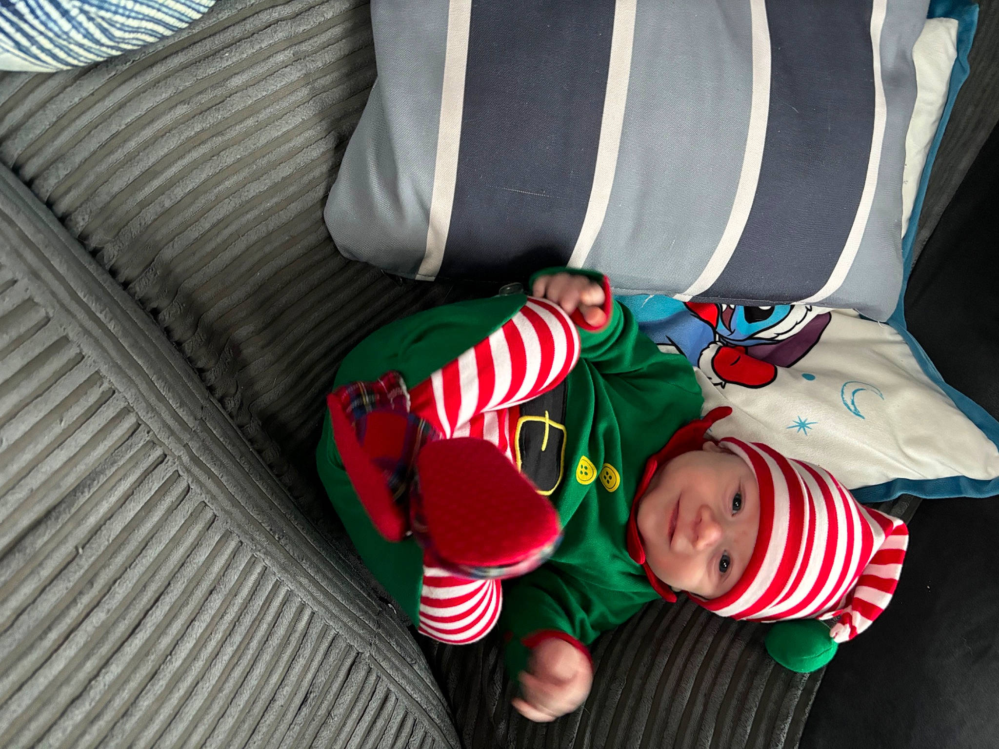 Teddy joined the competition — help win amazing prizes! baby, baby_toddler_clothing, carmine, child, christmas, christmas_eve, comfort, event, fictional_character, flooring, headwear, holiday, lap, linens, pattern, person, room, sleeve, sock, toddler