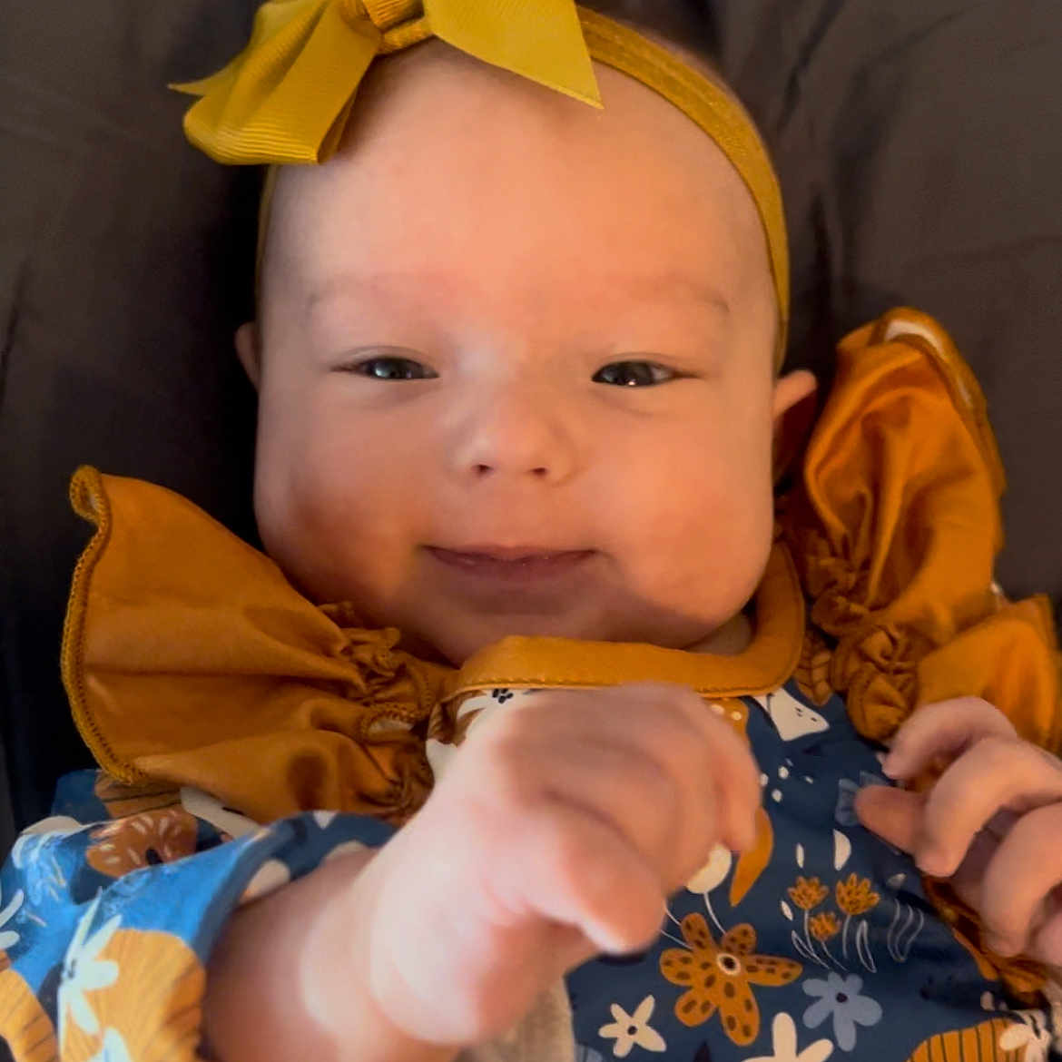 Sydney is registered to the contest to win money with this photo: accessories, applique, baby, bodypart, bonnet, clothing, couch, dress, face, finger, furniture, hand, hat, head, headband, newborn, pattern, person, photography, portrait